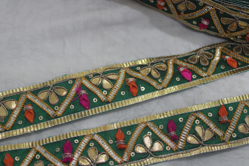 Emerald Enchantment: Green Gota Trim with Multicolor Handwork