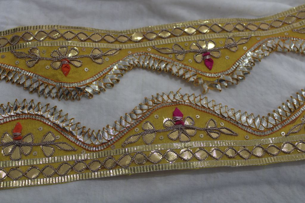 Sunlit Harmony: Scalloped Yellow Gota Trim with Multicolor Threadwork