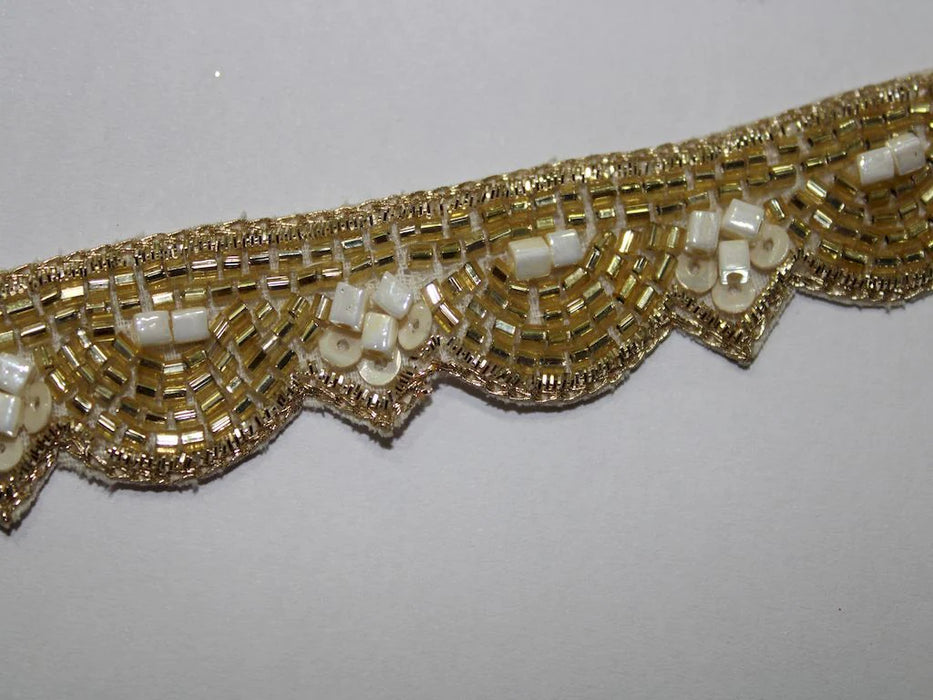 Scalloped Opulence: Golden Zari and Cutdana Handwork with White Detailing