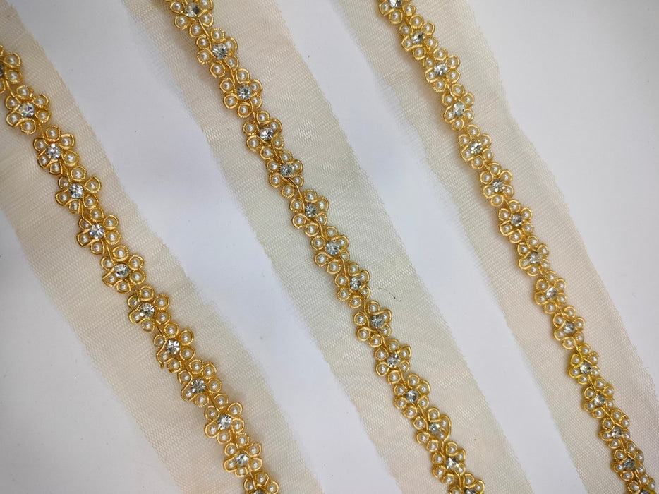 Golden Bloom: Floral Pearl Handwork with Gold Zari