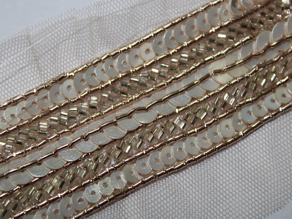 Ivory Radiance: Golden Cutdana and Rose Gold Zari Handwork Trim