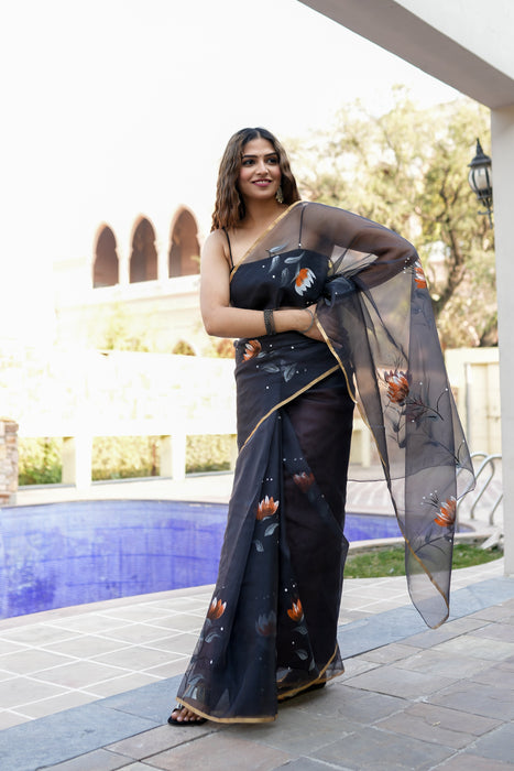 Divine Ink Drapes (Handpainted Black Organza Zari border saree)