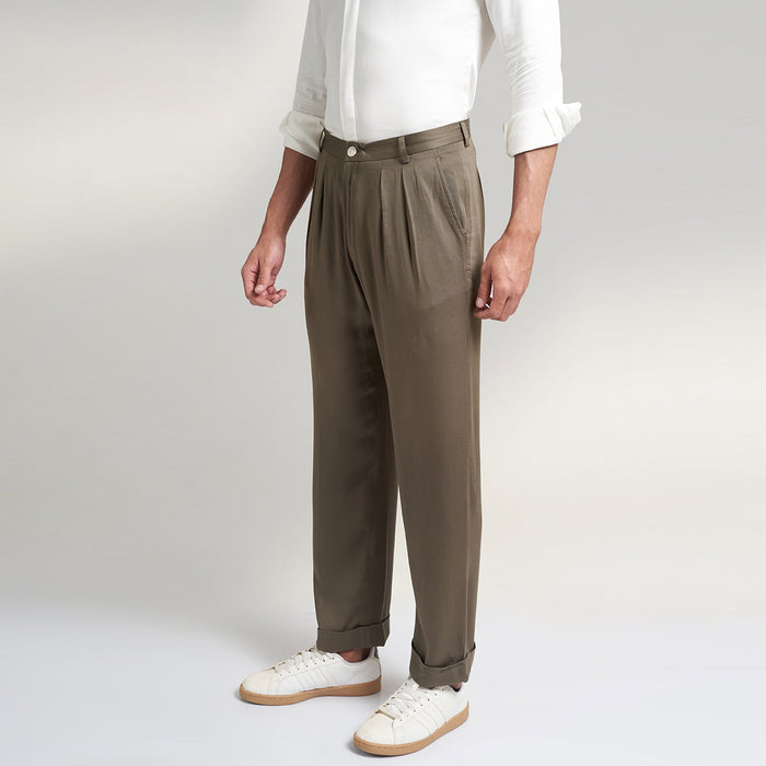 Lotus Stem fabric trousers, inspired by the timeless elegance of our Antique Reminiscence Collection. These trousers feature a comfortable fit, adorned with two front pleats and a stylish turn-up bottom. The super-soft fabric ensures a luxurious feel, making them an ideal choice for your leisurewear wardrobe.