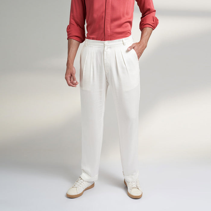 A COMFORT fit trousers in organic lotus stem fabric with 2 front pleats and turn up bottom and one back pocket details. the Trouser is super soft and comfortable to wear.