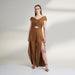 A brown tan color jumpsuit with wrap around ruched front bodice with overlap front slit pants.