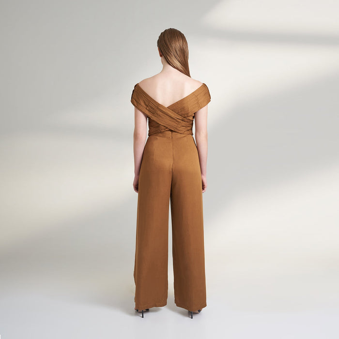 A brown tan color jumpsuit with wrap around ruched front bodice with overlap front slit pants.