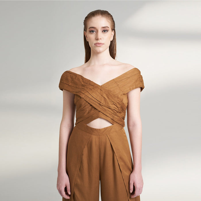 A brown tan color jumpsuit with wrap around ruched front bodice with overlap front slit pants.