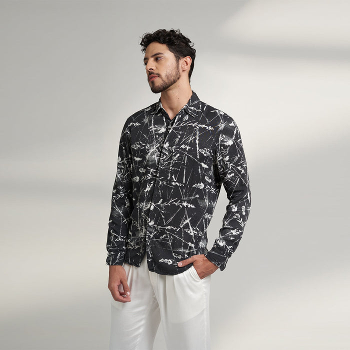 Organic lotus stem fabric printed shirt in black and white leafy print. the shirt has round bottom hem with a comfort fit