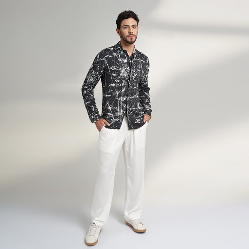 Organic lotus stem fabric printed shirt in black and white leafy print. the shirt has round bottom hem with a comfort fit