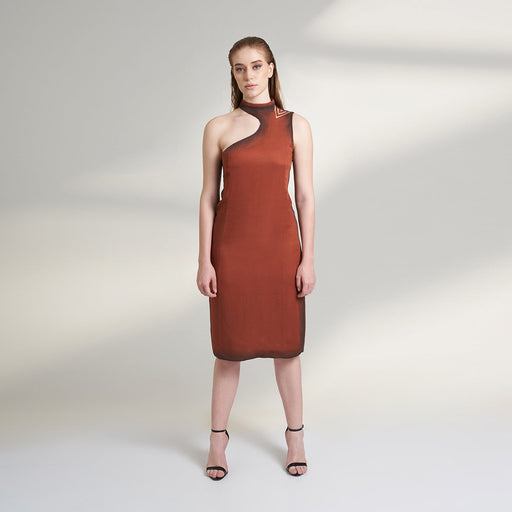 A global medium size model wearing a maroon wine dress with an asymmetrical neckline and a cut-work on left shoulder highlighted with ombre edges all over; crafted in organic lotus stem fabric.