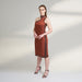 A global medium size model wearing a maroon wine dress with an asymmetrical neckline and a cut-work on left shoulder highlighted with ombre edges all over; crafted in organic lotus stem fabric.