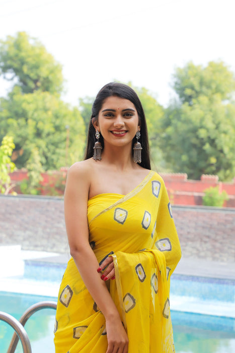 Filmy Tracey (Yellow Bandhej Chiffon Saree with Zari Border)