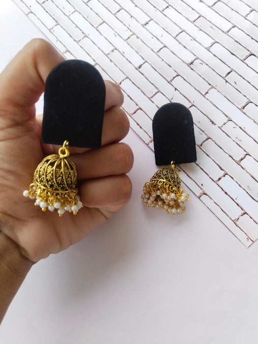 Plain black earrings with golden bottom